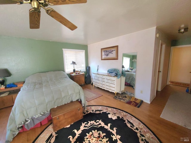 bedroom featuring hardwood / wood-style floors and ceiling fan