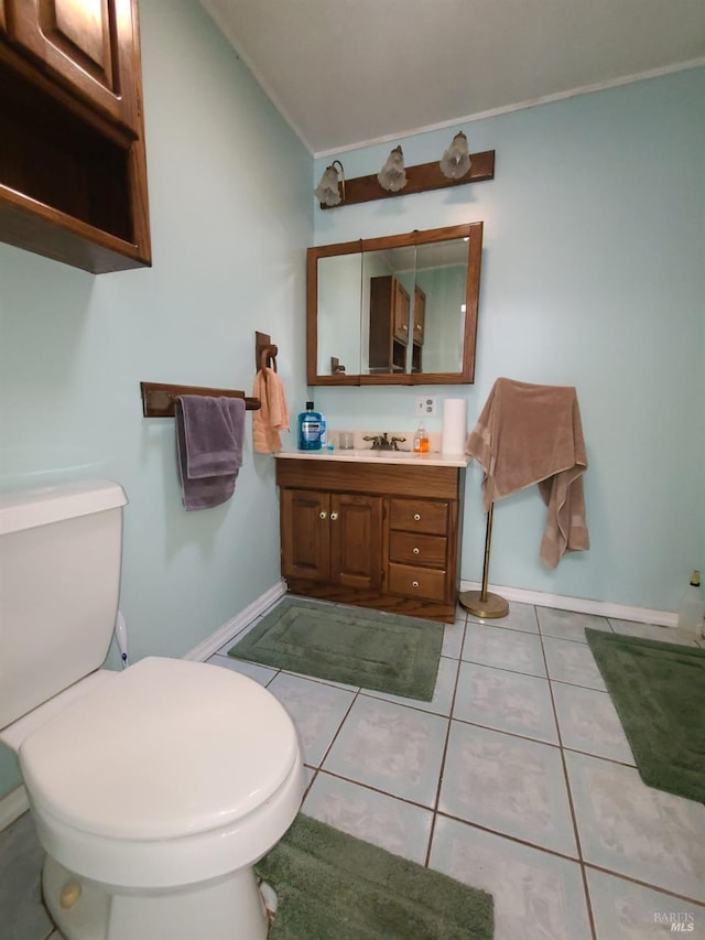 bathroom with ornamental molding, tile patterned flooring, vanity, and toilet