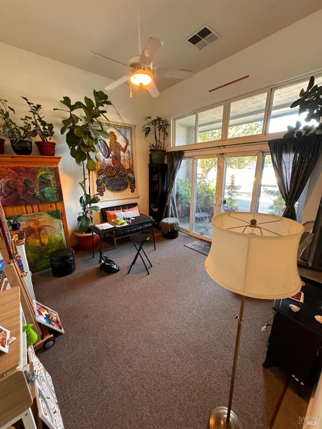 interior space with ceiling fan, french doors, and carpet flooring