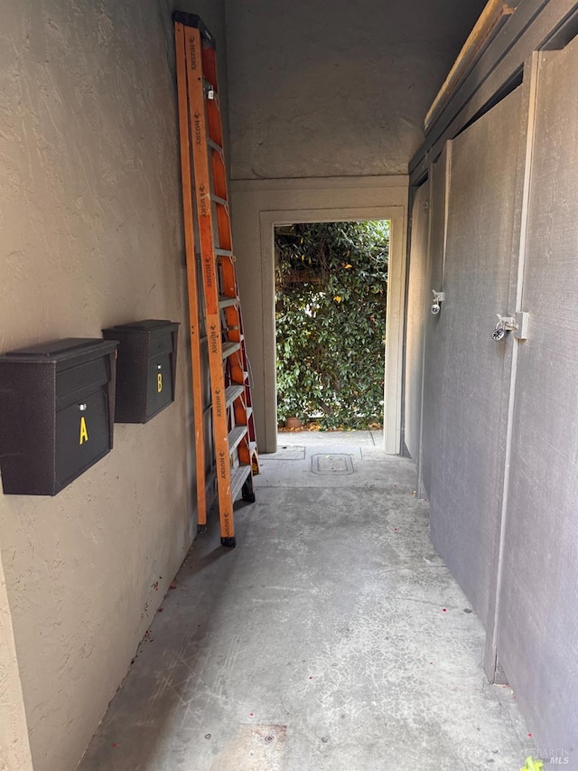 corridor featuring concrete floors