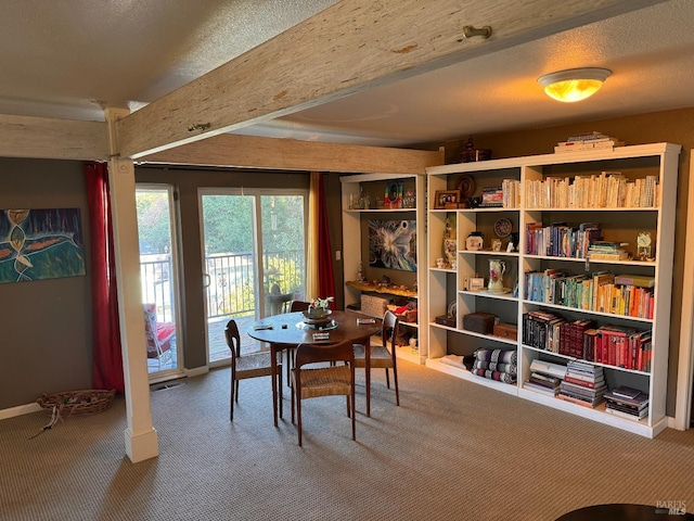 view of carpeted dining area