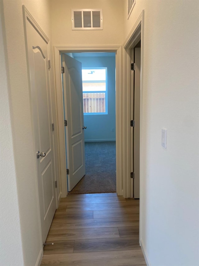 corridor with dark wood-type flooring