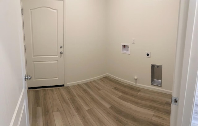 clothes washing area with hookup for a washing machine, hookup for an electric dryer, light wood-type flooring, and hookup for a gas dryer