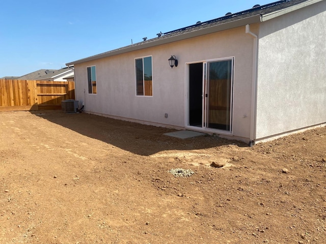 rear view of house with central AC