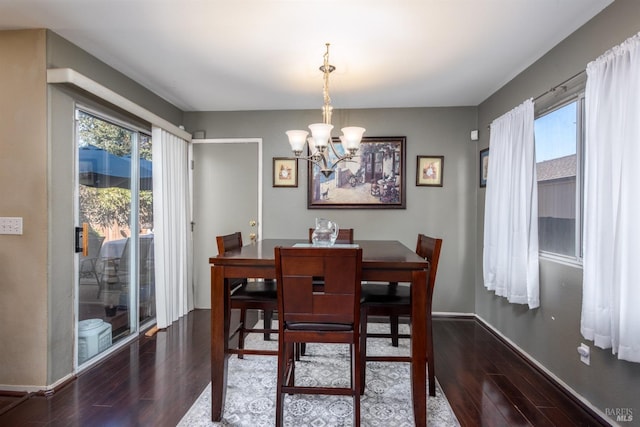 dining area with a chandelier and hardwood / wood-style flooring