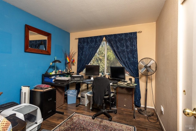 office featuring dark hardwood / wood-style flooring and a textured ceiling