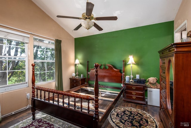 bedroom featuring ceiling fan, dark hardwood / wood-style flooring, and lofted ceiling