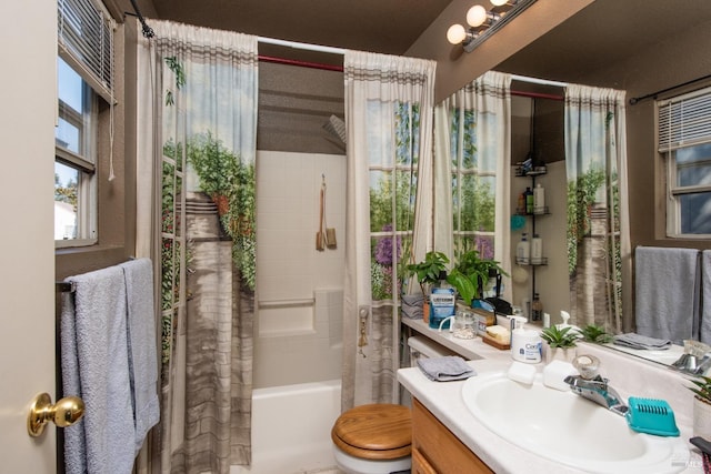 full bathroom featuring toilet, vanity, and shower / tub combo with curtain