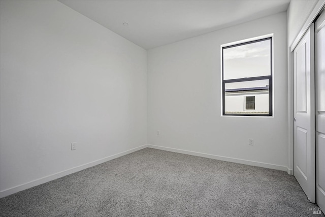 spare room featuring carpet floors