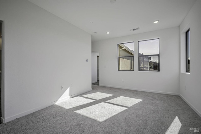 empty room with carpet flooring