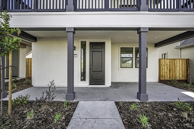 doorway to property featuring a balcony