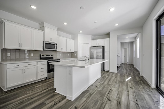 8953 Camino Colegio Rd, Rohnert Park, CA 94928 - kitchen with stainless steel appliances, a sink, dark wood finished floors, light countertops, and recessed lighting