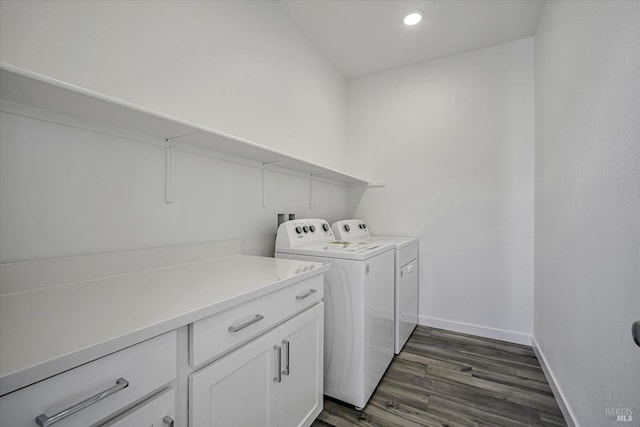 laundry room with cabinets, separate washer and dryer, and dark hardwood / wood-style floors