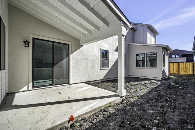 doorway to property featuring a patio area