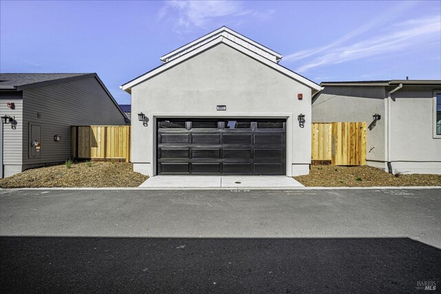 view of front of house with an outbuilding and a garage