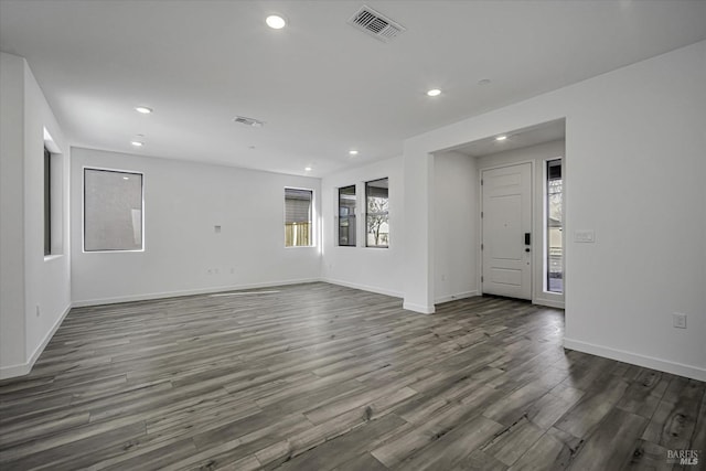 empty room featuring dark hardwood / wood-style flooring