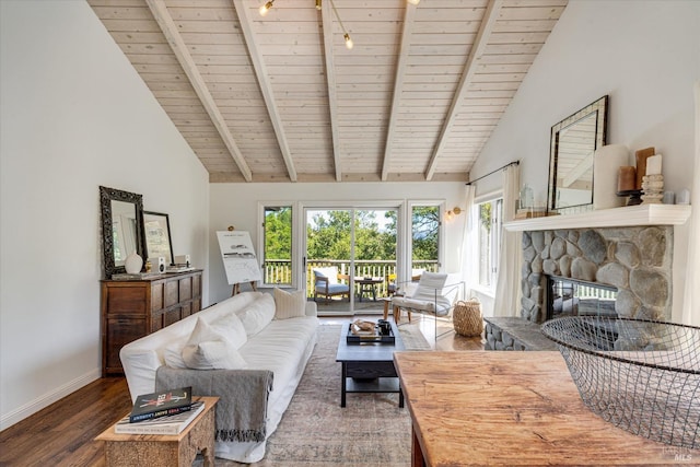 living room featuring wooden ceiling, a healthy amount of sunlight, a stone fireplace, and dark hardwood / wood-style floors