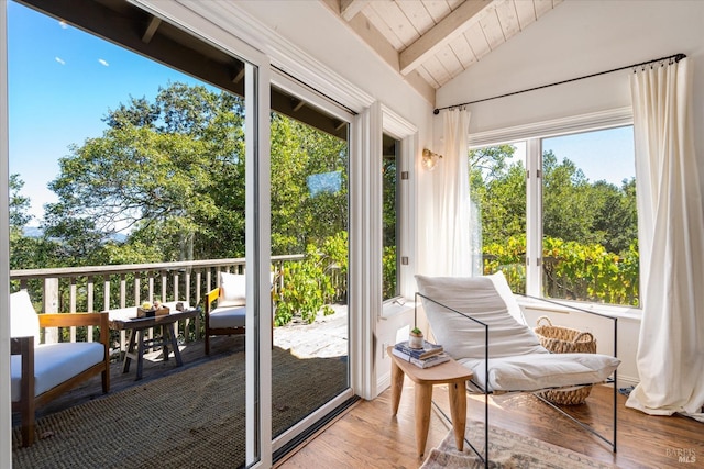 sunroom / solarium featuring wood ceiling and lofted ceiling with beams