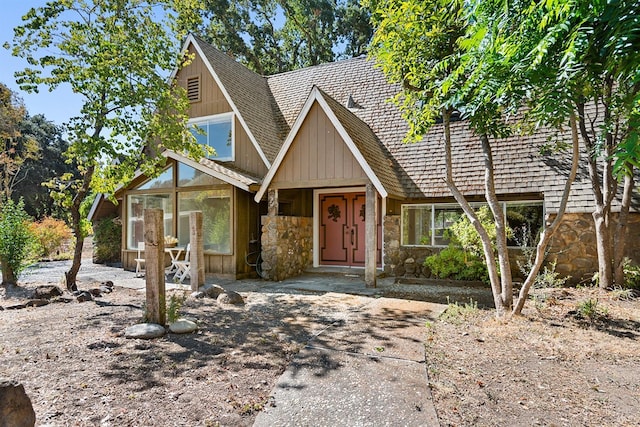 view of front of property featuring a sunroom