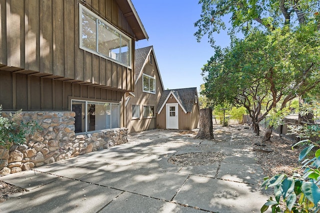 view of patio / terrace with a shed