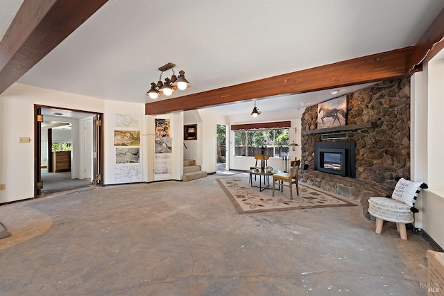 unfurnished living room featuring a stone fireplace, beamed ceiling, and a notable chandelier