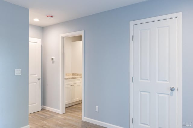 hallway with light wood-type flooring