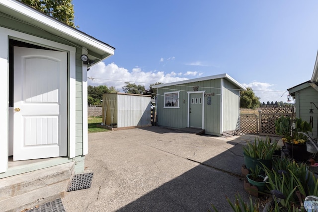 view of patio featuring a storage shed