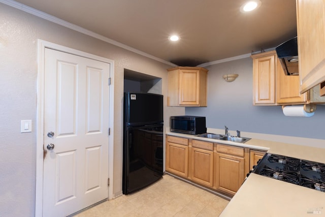 kitchen featuring light brown cabinetry, ornamental molding, sink, and black fridge