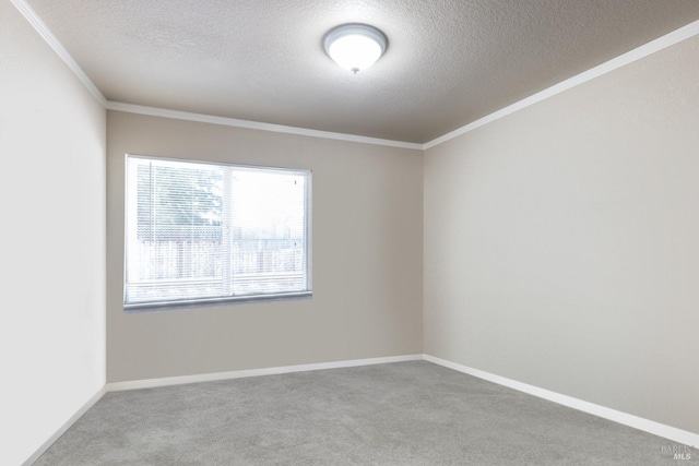 carpeted empty room with a textured ceiling and crown molding