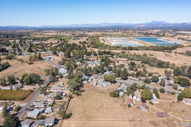 bird's eye view with a water and mountain view