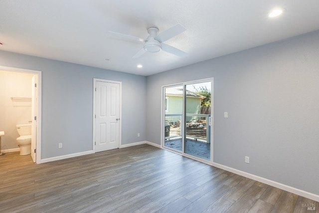 unfurnished room featuring light wood-type flooring, ceiling fan, a closet, and access to exterior