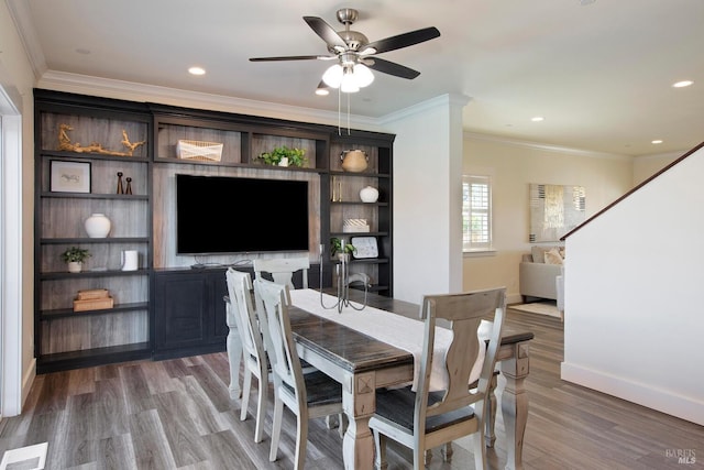 dining area featuring ornamental molding, hardwood / wood-style floors, and ceiling fan