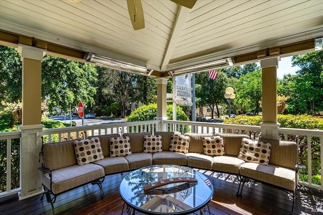 wooden deck featuring an outdoor fire pit