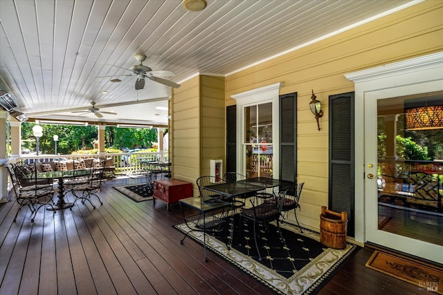 wooden deck featuring ceiling fan