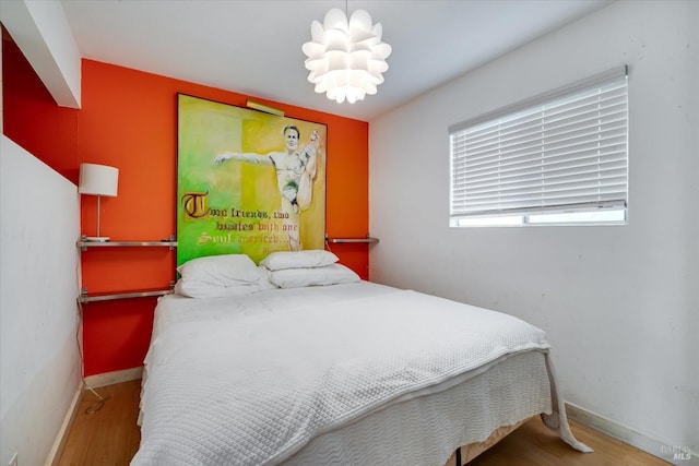 bedroom with hardwood / wood-style floors