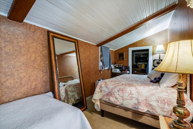 bedroom featuring lofted ceiling with beams