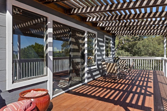 wooden deck featuring a pergola