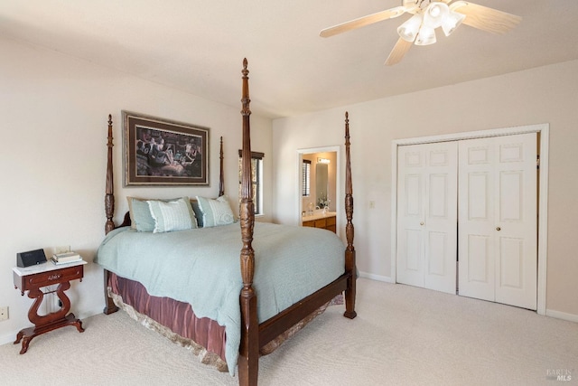 bedroom with ceiling fan, ensuite bathroom, a closet, and carpet flooring