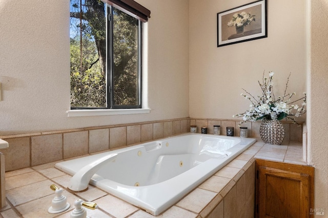 bathroom featuring tiled bath