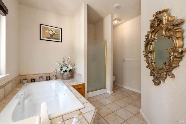 bathroom featuring independent shower and bath, tile patterned flooring, and toilet