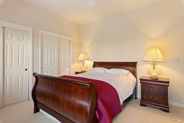 bedroom with light carpet and ceiling fan