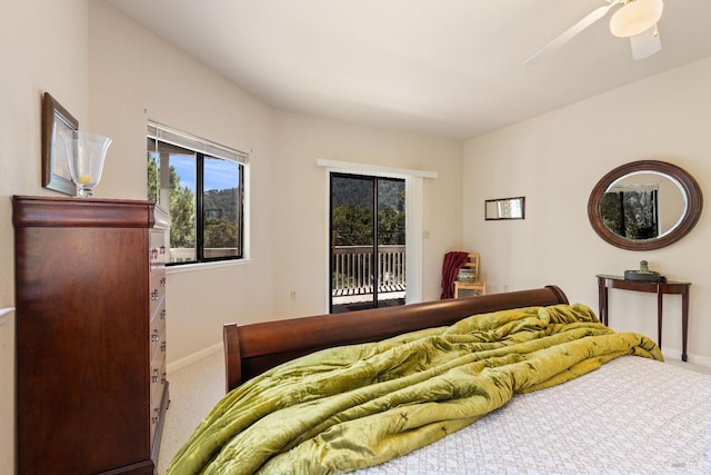 carpeted bedroom with ceiling fan and access to exterior