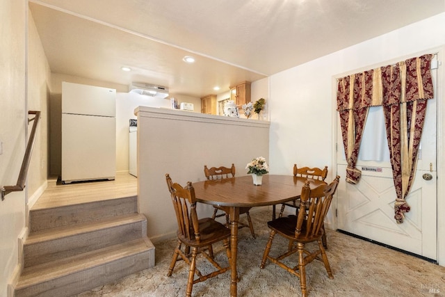 view of carpeted dining space