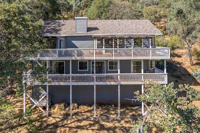 back of house with a balcony