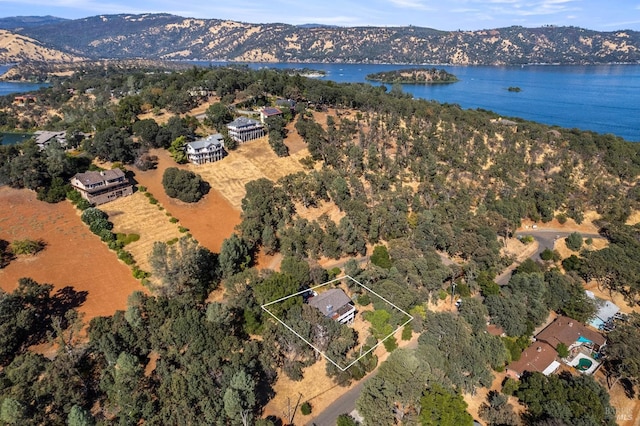 bird's eye view with a water and mountain view