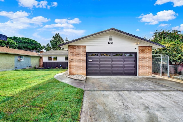 ranch-style house with a garage and a front lawn