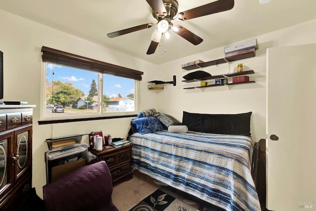 carpeted bedroom featuring ceiling fan