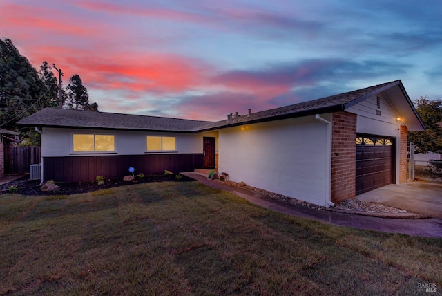 ranch-style home with a yard