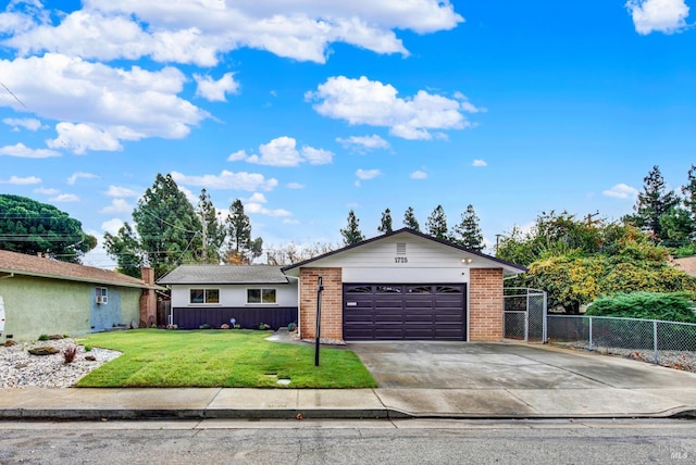 single story home with a front yard and a garage