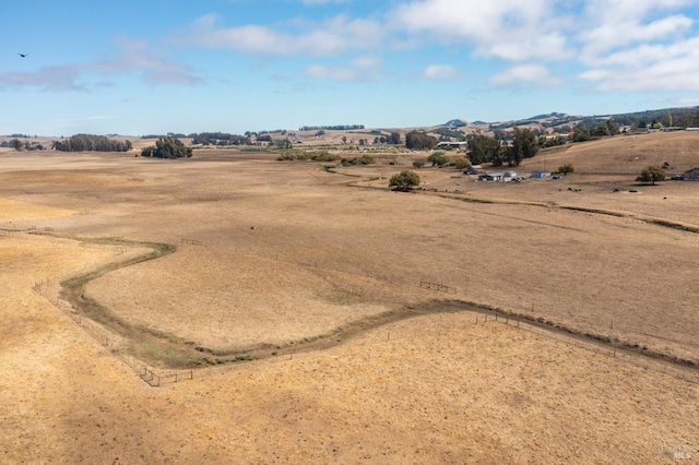 birds eye view of property featuring a rural view